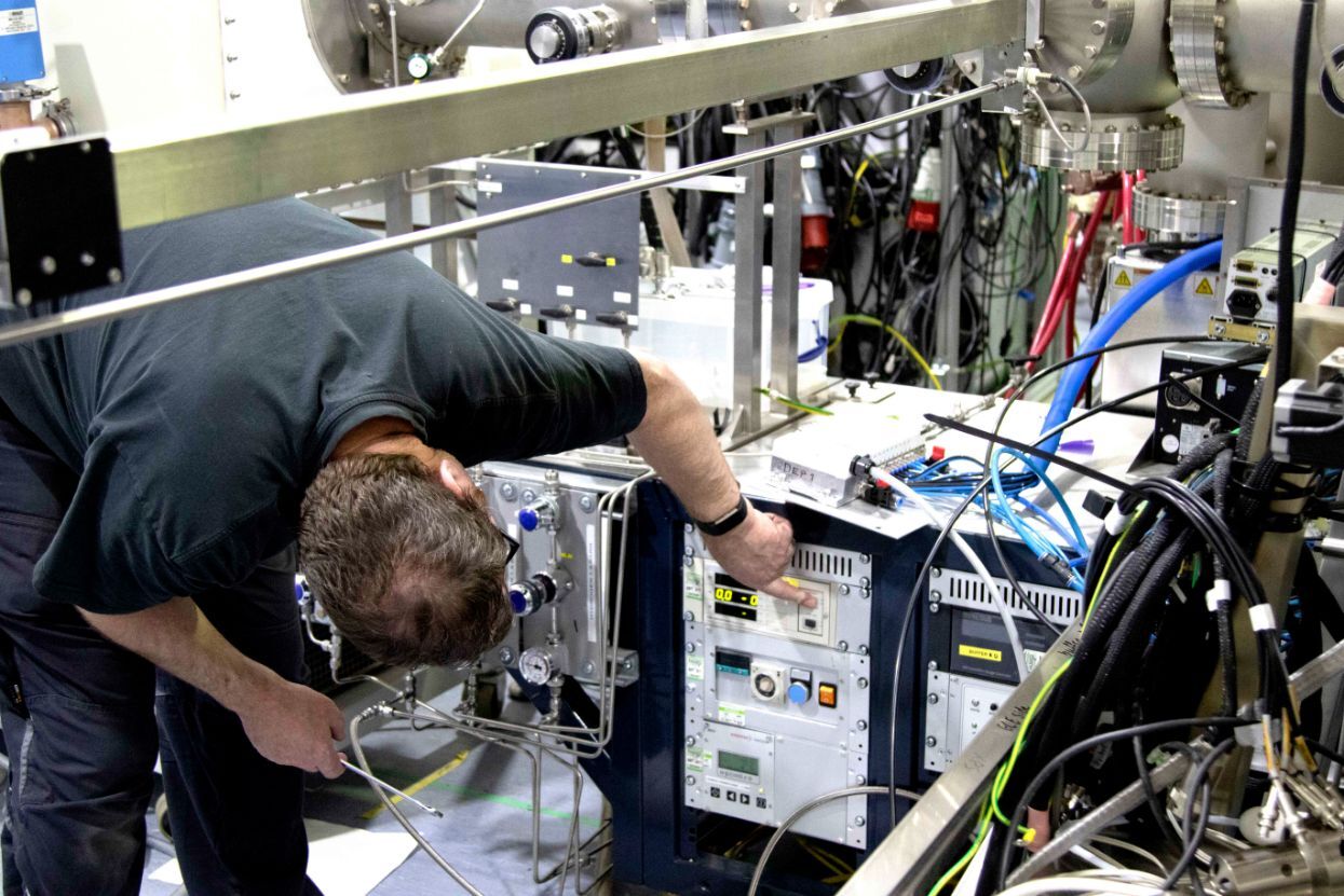 IES engineer modifying complex equipment