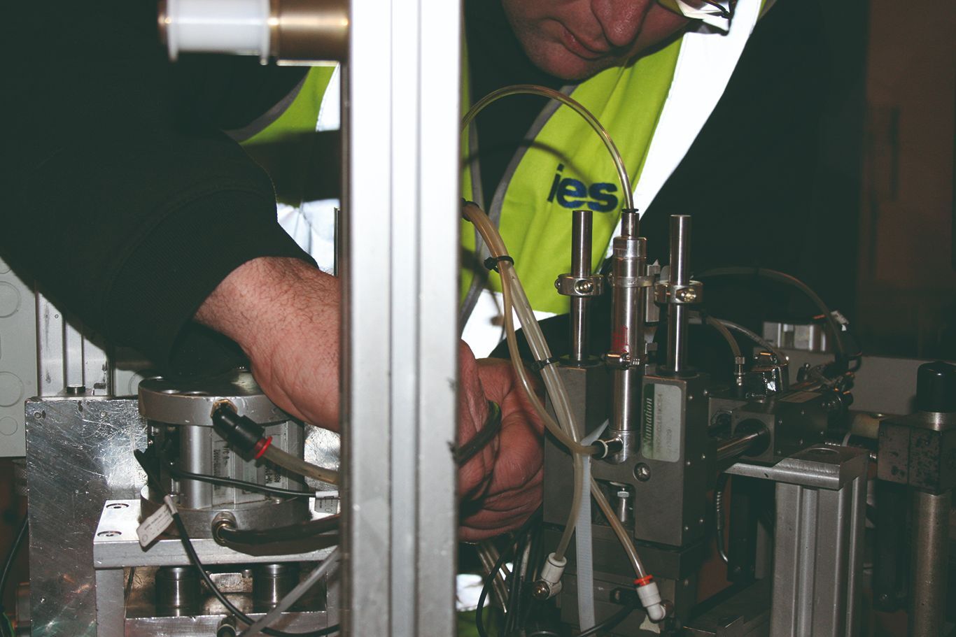 IES engineer modifying some complex equipment