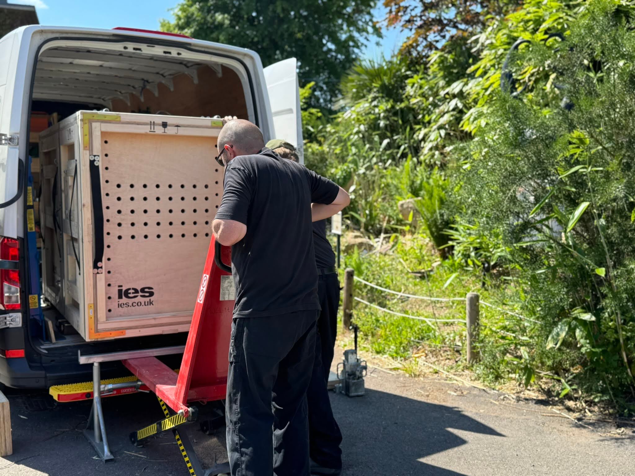 IES Team Off Loading Crate from Transport