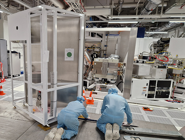 IES engineers installing a semiconductor ion implanter