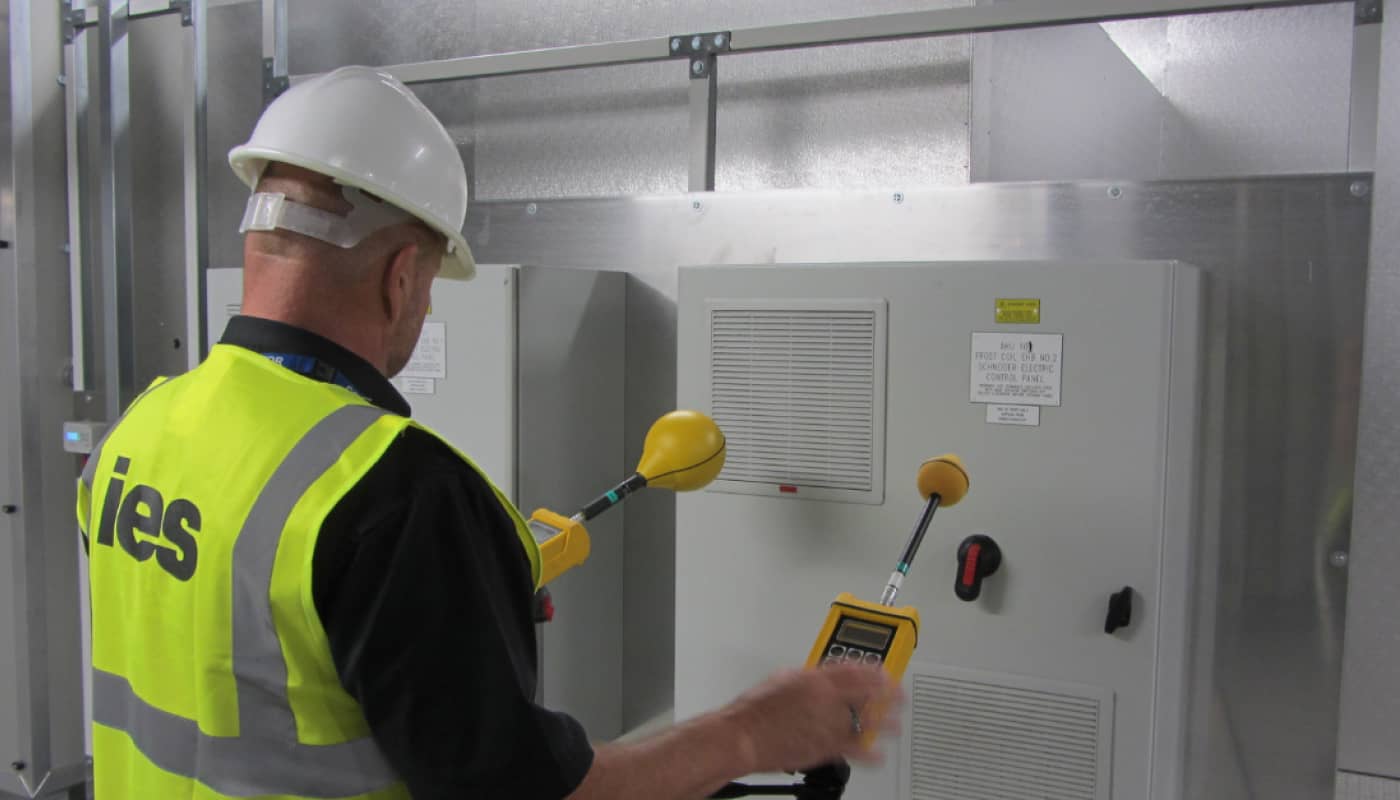 Engineer carrying out compliance testing on equipment